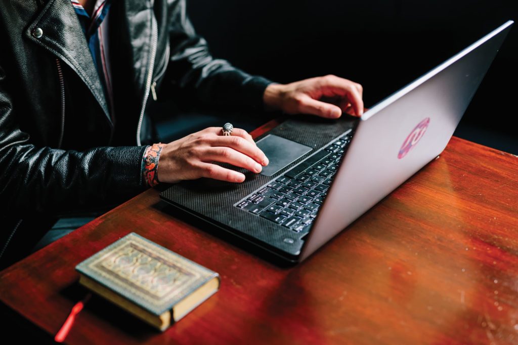 BIMM Student working at a Laptop